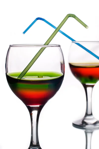 Bebidas de color arco iris con pajitas — Foto de Stock