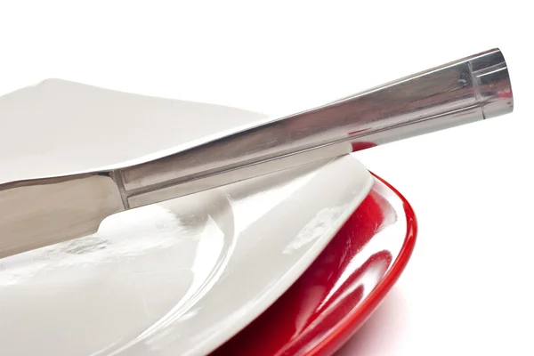 Cuchillo de plata en un plato — Foto de Stock