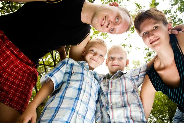 Familia alegre con gemelos hermosos —  Fotos de Stock