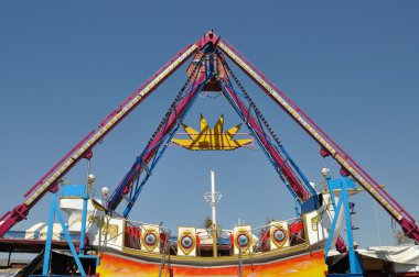 Swing in amusement park clipart