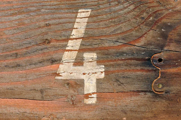 Номер четыре деревянный фон — стоковое фото