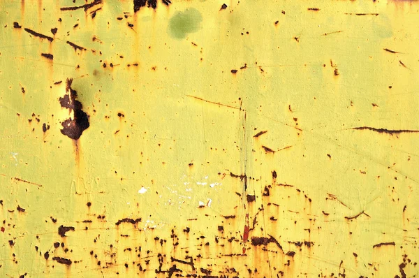 Pintura amarilla astillada sobre hierro oxidado —  Fotos de Stock