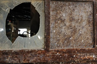 Rusty factory door and smashed glass clipart