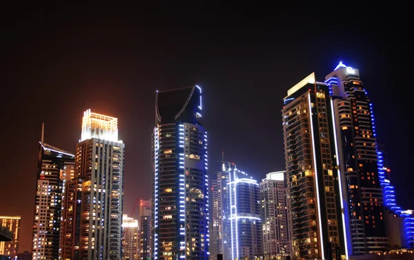 Dubai om natten - Stock-foto