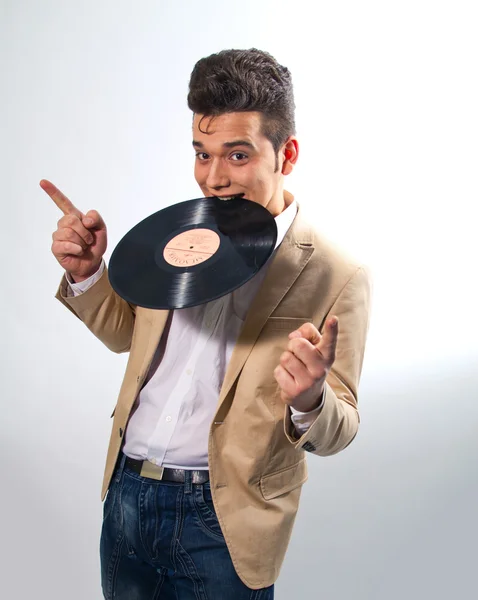 Vinyl record in the hands of a man in the style of Elvis Presley — Stock Image Vinyl record in the hands of a man in the style of Elvis Presley Royalty Free Stock Photos