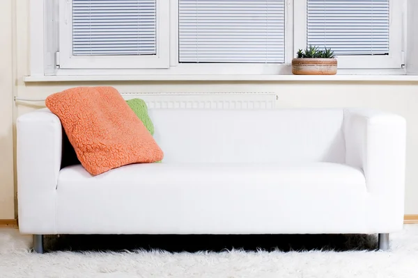 Modern white sofa and white carpet — Stock Photo, Image