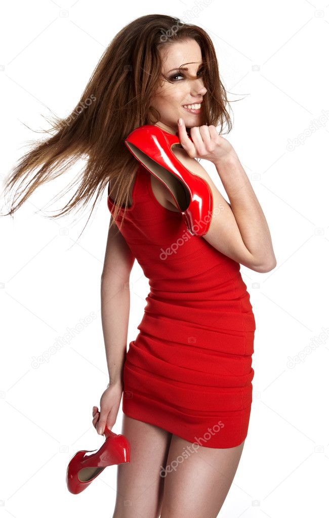 Beautiful woman after shopping holding shoes . Girl and shoe