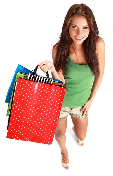 Hermosa, joven, mujer con bolsas de compras de colores en la mano — Foto de Stock