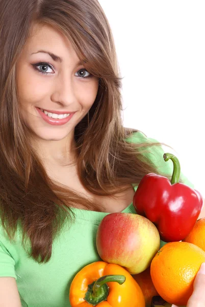 Portrait of a girl holding in hands full of different fruits an — Stock Photo, Image