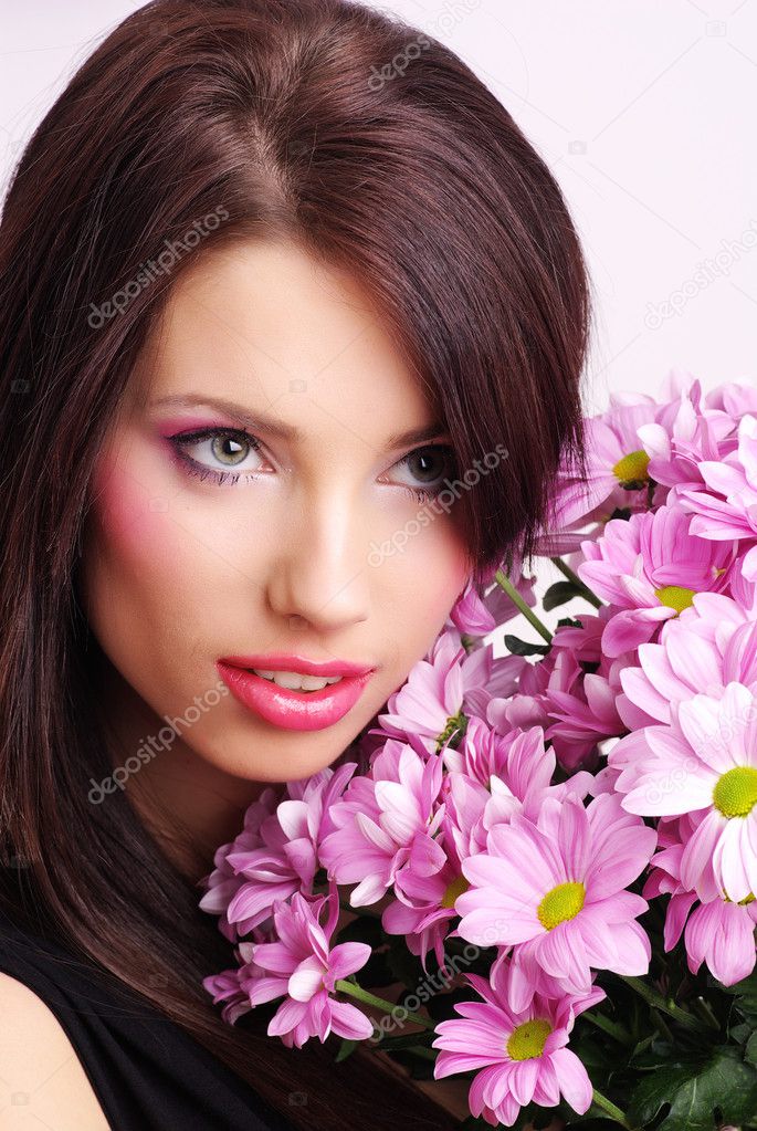 Young woman face with flowers