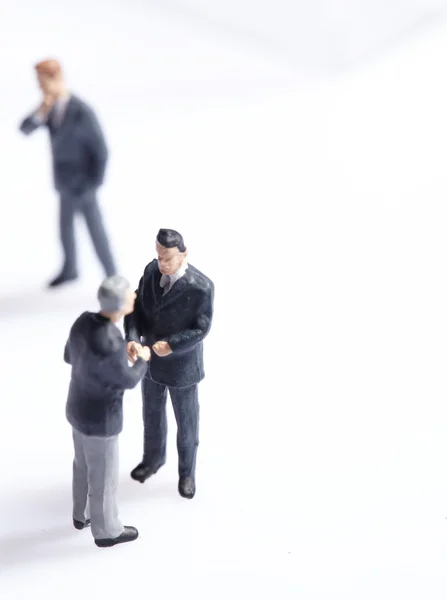 Business figurines standing — Stock Photo, Image