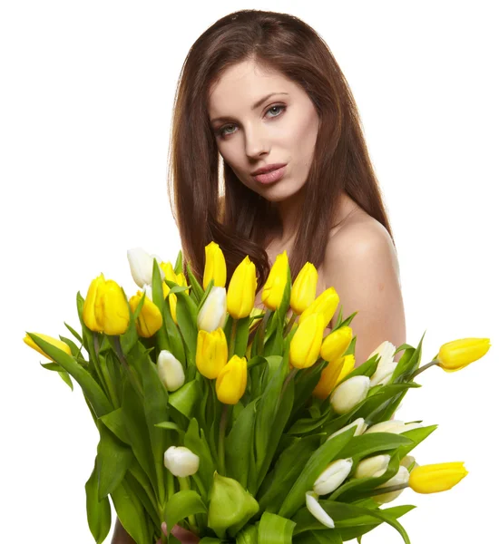 Glad kvinna med gula tulpaner isolerad på vit bakgrund — Stockfoto