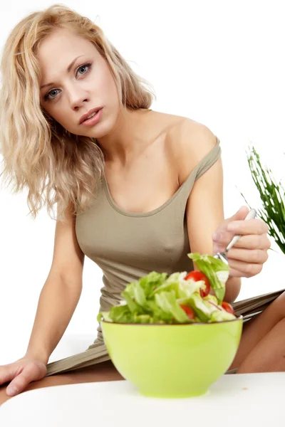 Portrait of young happy smiling woman eating salad — Stock Photo, Image