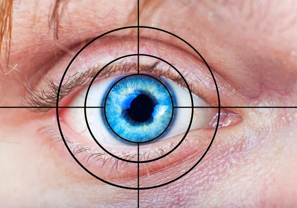Man's blue eye and target — Stock Photo, Image