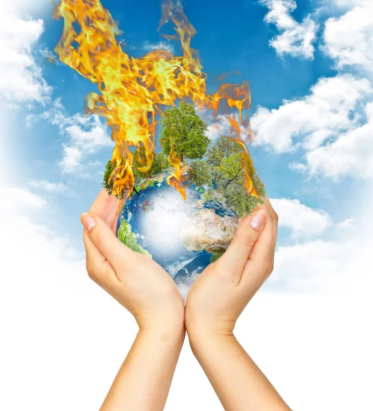 Womanish hands holding burning Earth — Stock Photo, Image
