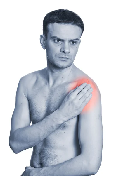 Giovane uomo tenendo la spalla con dolore — Foto Stock