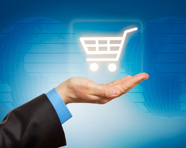 Man hand holding shopping cart icon — Stock Photo, Image