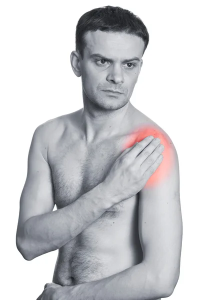 Rear view of a young man holding her neck in pain — Stock Photo, Image