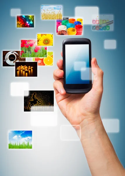 Hand holding Multimedia phone — Stock Photo, Image