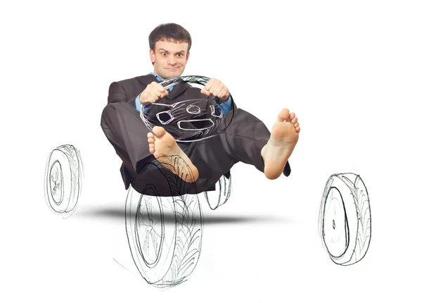 Businessman simulates driving a car — Stock Photo, Image