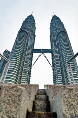 Beautiful view on blue sky of Petronas Twin Towers clipart