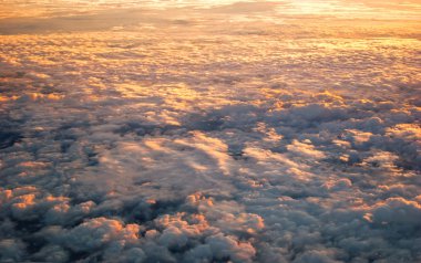 Spectacular view of a sunset above the clouds clipart