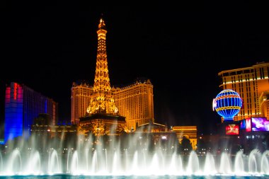 The Musical fountains on Eiffel Tower of Hotel Paris background clipart