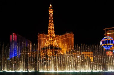 The Musical fountains on Eiffel Tower of Hotel Paris background clipart