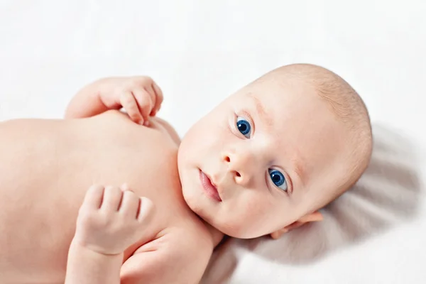 Picture of the newborn resting on a bed — Stock Photo, Image
