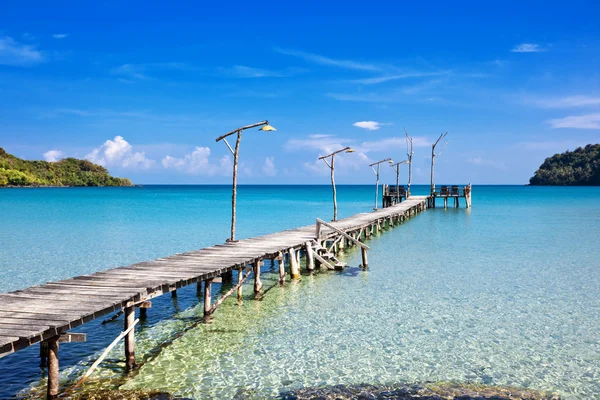 Old wooden pier in the sea — Stock Photo, Image