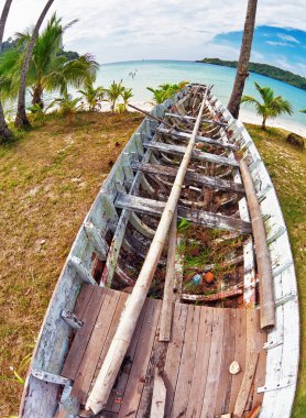 Old Thai boat at the beach clipart