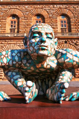 FLORENCE, ITALY - JUNE 28: Abstract puzzling sculpture of man cr clipart