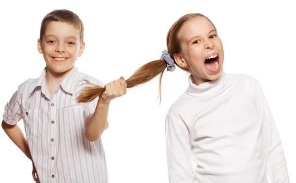 Boy pulls the girl's hair — Stock Photo, Image