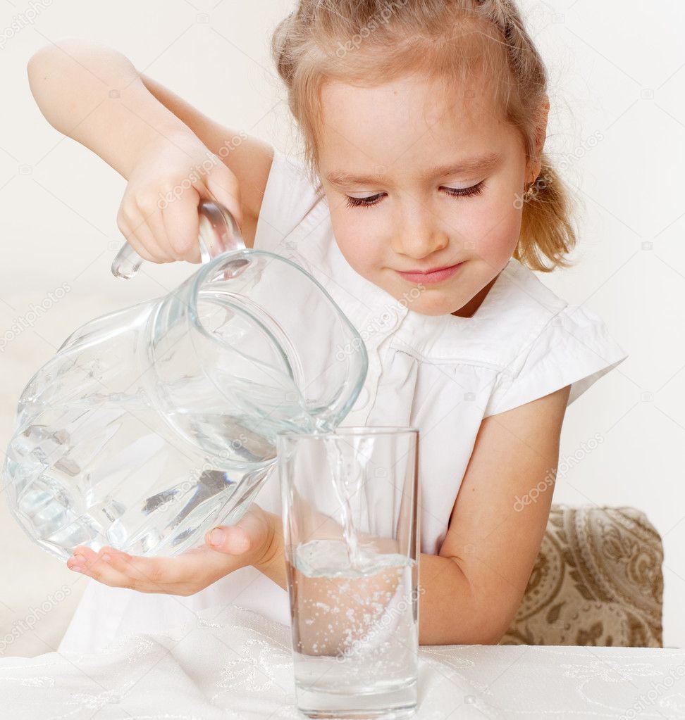 Child with glass pitcher water