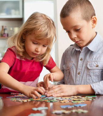 Children, playing puzzles clipart