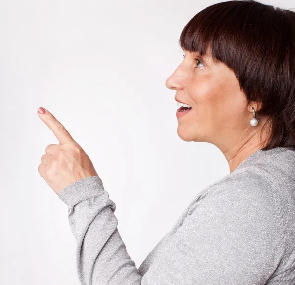 Mid woman showing a finger in the direction — Stock Photo, Image