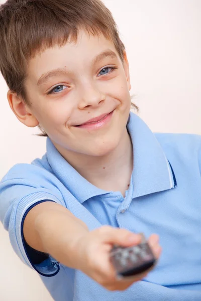 Menino com controle remoto — Fotografia de Stock