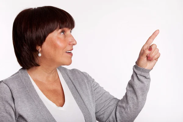 Mid woman showing a finger in the direction — Stock Photo, Image