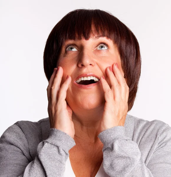 Surprised woman looking up — Stock Photo, Image