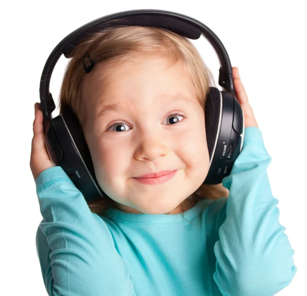Little girl in headphones Stock Picture