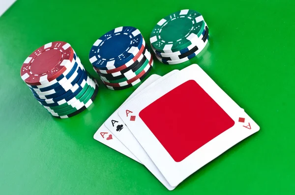 stock image Counters and playing cards on a green background