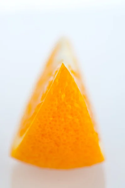 Fresh segments of an orange on a white background — Stock Photo, Image