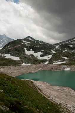 Alps near WeiВ§see with fog in Uttendorf clipart