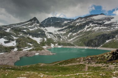 Alps near Wei§see with fog in Uttendorf clipart