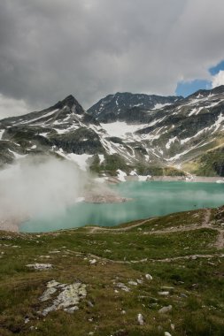 Alps near WeiВ§see with fog in Uttendorf clipart