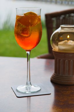 Aperol in a glass on the table clipart