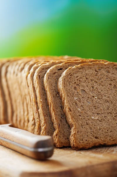 Cut rye bread and knife — Stock Photo, Image
