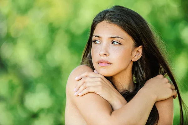 Beautiful woman with bare shoulders crossed her arms — Stock Photo, Image