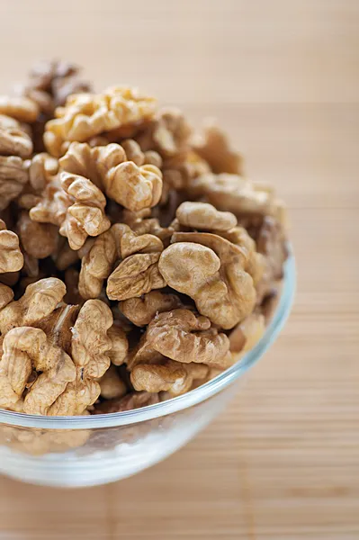 Shelled walnuts in glass plate — Stock Photo, Image