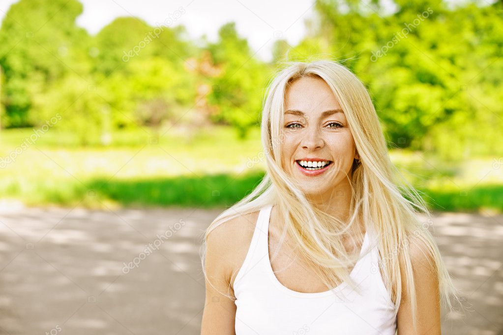 Young woman laughs merrily